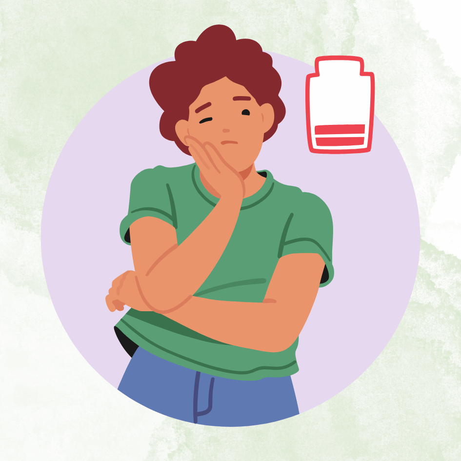 przemęczona pracownica z ikoną rozładowanej baterii – symbol spadku energii i pierwszych objawów wypalenia zawodowego